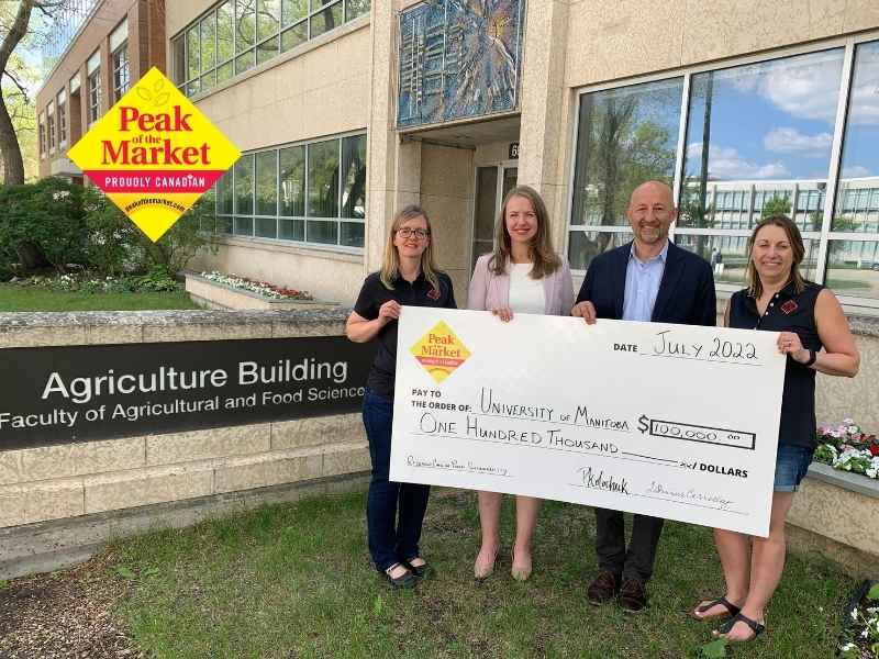 Peak of the Market Makes Donation to U of M